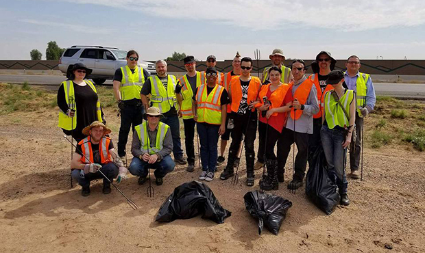 Members of The Satanic Temple - Arizona help pick up trash along the Interstate 10. (Facebook/The S...