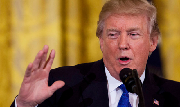 President Donald Trump speaks to a gathering of mayors in the East Room of the White House in Washi...