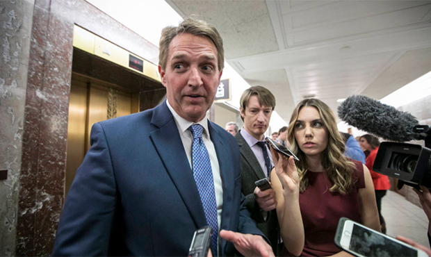FILE - In this Jan. 25, 2018 file photo, Sen. Jeff Flake, R-Ariz., speaks to reporters on Capitol H...