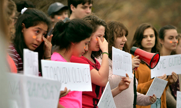 Around 50 Polk County High School students participated in a walk-out from school on Tuesday, Feb. ...