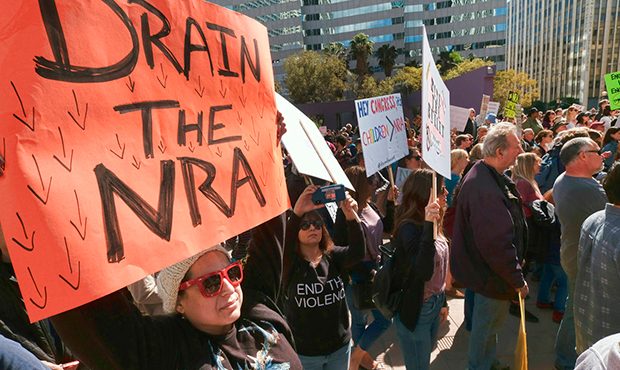 Lori Quintanilla, joins protestors on a during a rally against gun violence in downtown Los Angeles...