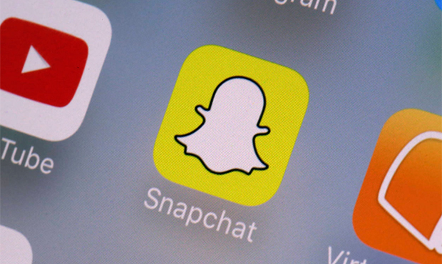 This Wednesday, Aug. 9, 2017, photo shows the Snapchat app on a mobile device in New York. Snap Inc...