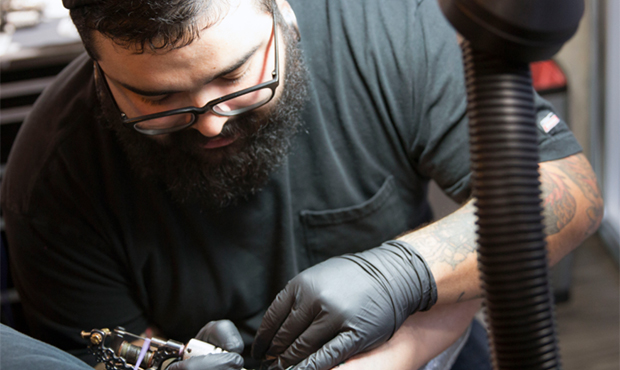 Manny Hernandez, a Phoenix tattoo artist, said consumers should always do research on tattoo shops ...