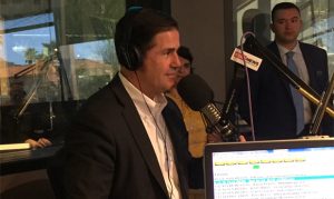 Gov. Doug Ducey visits KTAR amid large protest of educators, supporters