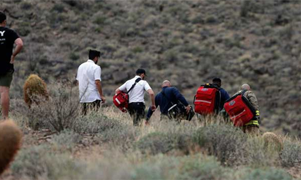In this Saturday, Feb. 10, 2018, file photo, emergency personnel arrive at the scene of a deadly to...