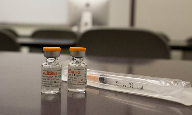 Shot in the Dark is passing out clean hypodermic needles and vials of the opioid overdose-reversal ...