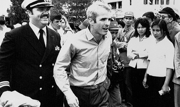John S. McCain III is escorted by Lt. Cmdr. Jay Coupe Jr., public relations officer, March 14, 1973...