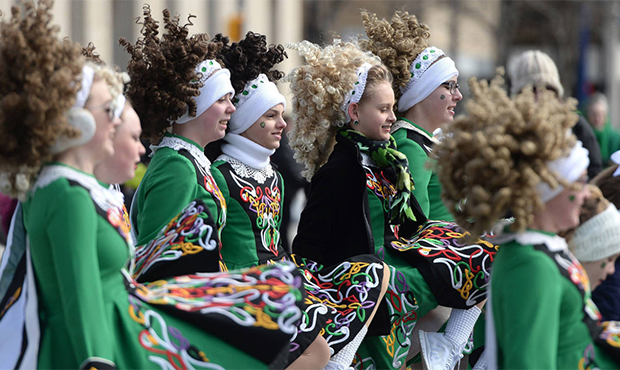 The Rice Na Tiarna dancers march in the 41st annual St. Patrick's Day parade on State Street in Eri...