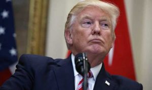 Trump signs spending bill after threatening veto over immigration