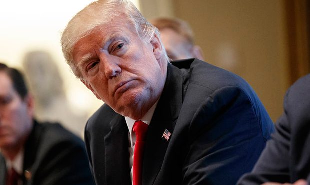 President Donald Trump listens during a meeting with steel and aluminum executives in the Cabinet R...