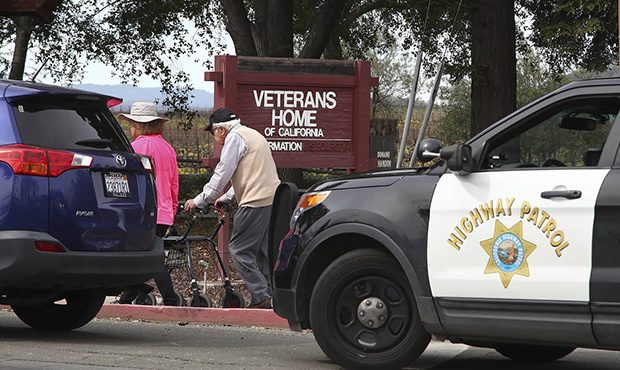 People walk to the information center at the Veterans Home of California in Yountville, Calif., on ...