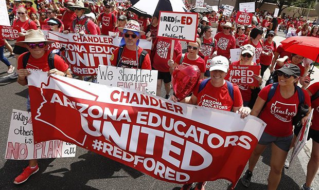 Thousands march to the Arizona Capitol for higher teacher pay and school funding Thursday, April 26...