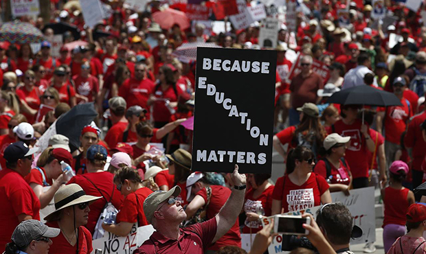 Thousands march to the Arizona Capitol for higher teacher pay and school funding Thursday, April 26...