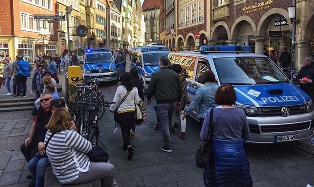 (dpa/AP Photo) Police vans stand in downtown Muenster, Germany, Saturday, April 7, 2018. German new...