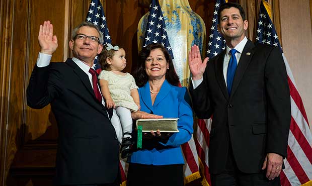 House Speaker Paul Ryan of Wis. administers the House oath of office to Rep. David Schweikert, R-Ar...