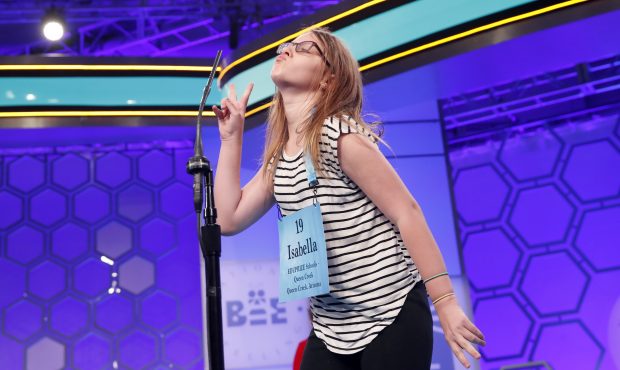 Isabella Padilla, 12, from San Tan Valley, Ariz., reacts after spelling her word correctly during t...