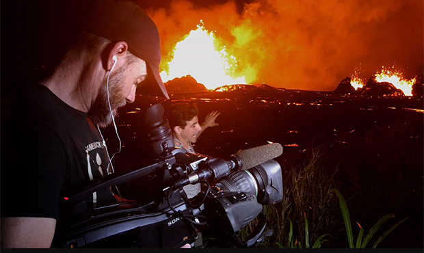 Lava shoots into the night sky from active fissures on the lower east rift of the Kilauea volcano, ...