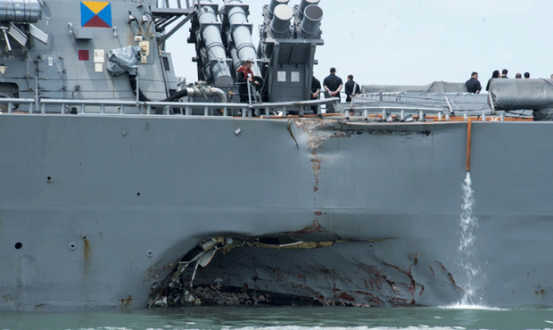 In this Aug. 21, 2017, photo, damage is visible as the guided-missile destroyer USS John S. McCain ...