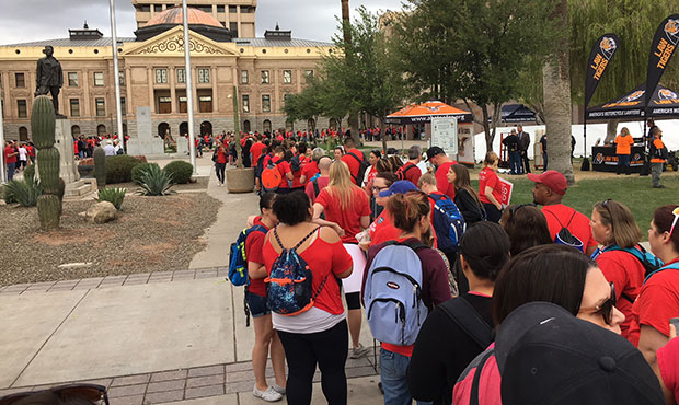 A line snakes around the Arizona State Capitol buildings in Phoenix on the fifth day of teacher wal...