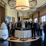 Twin Arrows Team with Robot and Cake