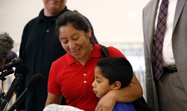 Beata Mariana de Jesus Mejia-Mejia, left, embraces her son Darwin Micheal Mejia as she speaks at a ...