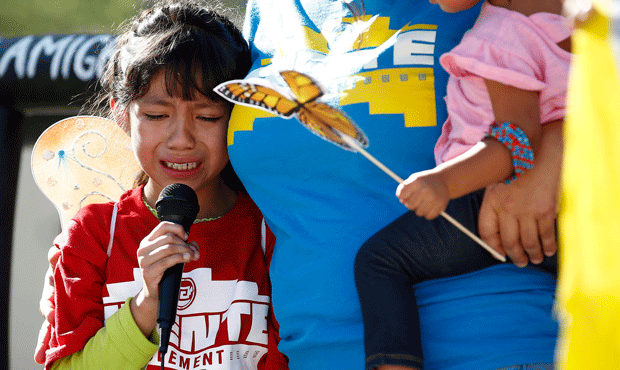 Akemi Vargas, 8, cries as she talks about being separated from her father during an immigration fam...