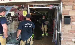 4 people, 2 children injured after car rams through Phoenix storefront