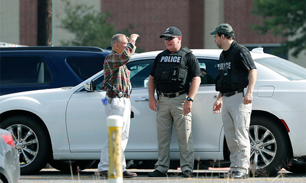 Police officers work a check point in front of Santa Fe High School in response to a shooting at th...