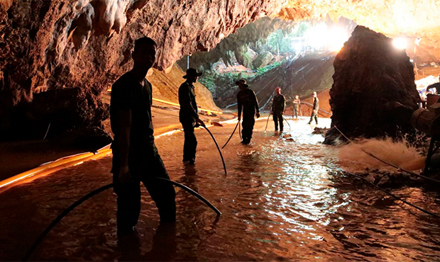 In this undated file photo provided by Royal Thai Navy on July 7, 2018, Thai rescue teams arrange a...