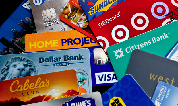 FILE- In this Jan. 31, 2018, file photo, an assortment of credit cards and rewards cards are shown ...
