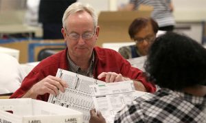 Maricopa County elections officials continue to count ballots amid lawsuit