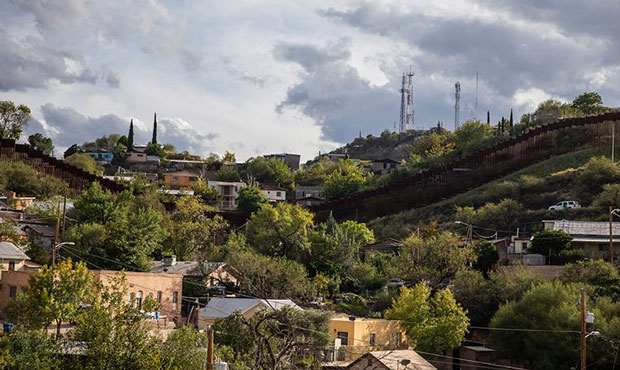A fence splits border town Nogales, with one half in Arizona and the other in Mexico. (Cronkite New...
