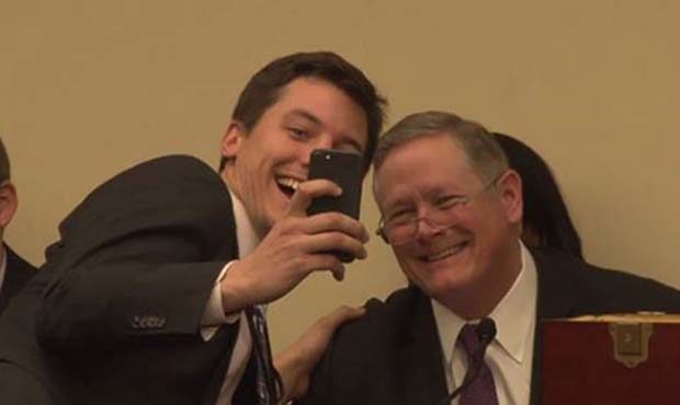 Eric Chalmers, an aide to Rep.-elect Greg Stanton, D-Phoenix, takes a selfie with House official Bi...