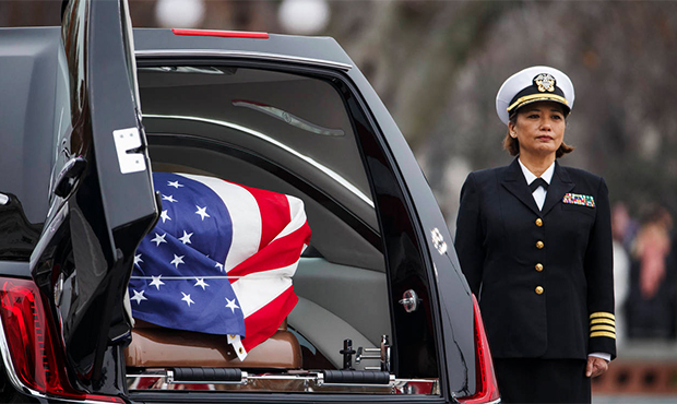 The casket of former President George H.W. Bush sits in a hearse in front of the U.S. Capitol, Wedn...