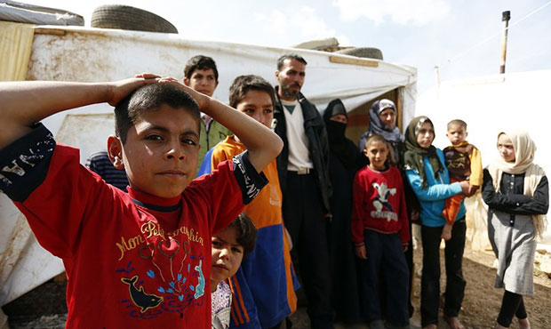 A family in a Lebanese refugee camp in 2013. The Trump administration cut refugee admissions this y...