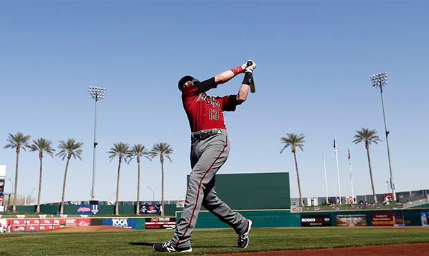 Arizona Diamondbacks' Nick Ahmed takes a practice swing as he waits to bat prior to a spring traini...