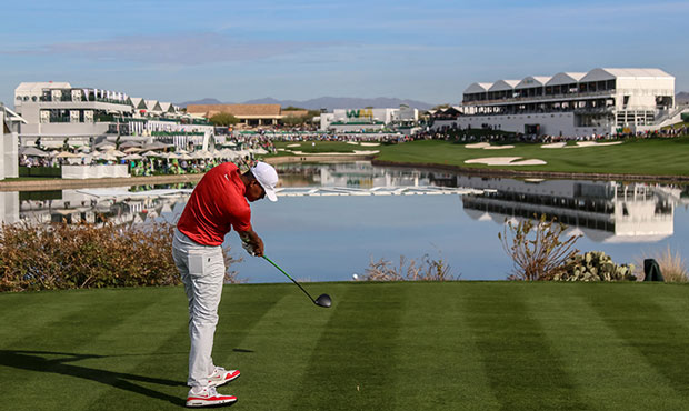 Tony Finau hits his tee shot down the 18th hole at the Waste Management Phoenix Open. Additional lu...