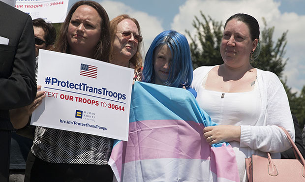 Jessica Girven and her 11-year-old daughter, Blue, who came out as transgender last year, stand in ...