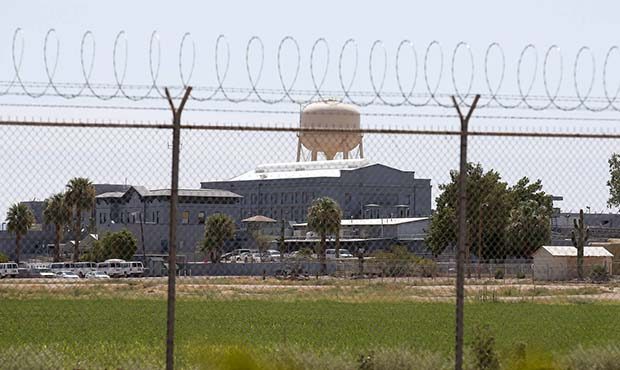 FILE - In this July 23, 2014, file photo, a fence surrounds the state prison in Florence, Ariz. Ari...