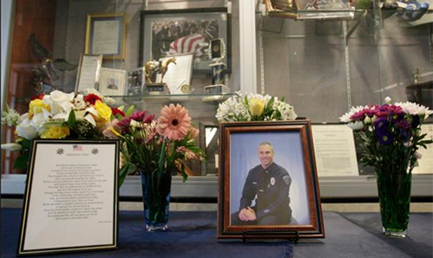 A memorial is set up at Gilbert police headquarters after the 2010 killing of Gilbert Police Office...