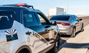 Why did a Mesa man get a speeding ticket for driving 65 in a 65 zone?