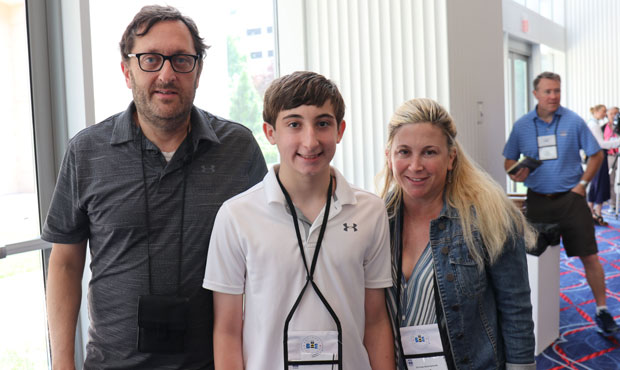 Scottsdale seventh-grader Max Greenspan, with his parents, David and Julie, successfully challenged...