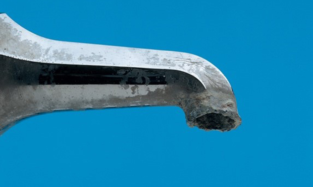 Accumulation of mineral deposits prevents water from flowing steadily. (Kinetico Water Systems Phot...