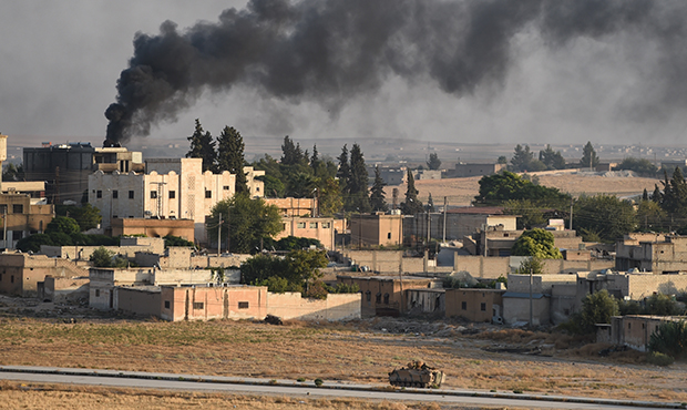 AKCAKALE, TURKEY - OCTOBER 13: A Turkish army armored vehicle advances in the Syrian city of Tel Ab...