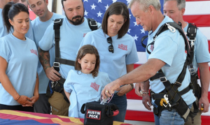 Family honors late Goodyear firefighter Austin Peck by sky-diving with ashes