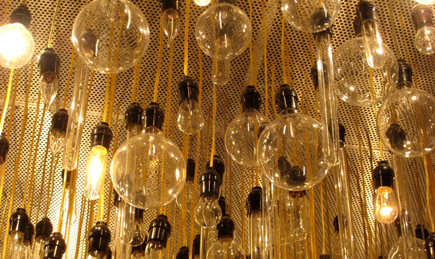 Regulations to steadily increase the energy efficiency of lightbulbs got their start under Presiden...