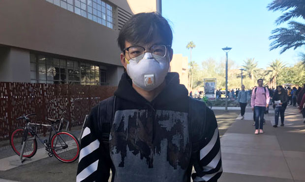 Jimmy Mei wore a medical mask Tuesday, Jan. 28, 2020, at Arizona State University days after a memb...