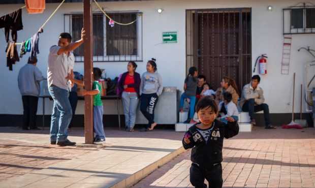 Migrant families wait at Casa del Migrante before they receive shots and medical care. (Photo by De...