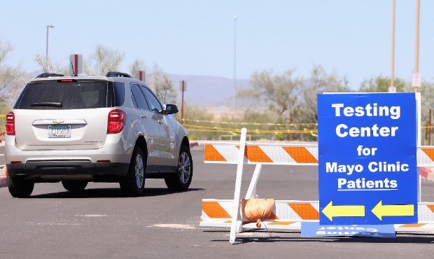 An SUV arrives to a testing site for coronavirus (COVID-19) erected in a parking lot at Mayo Clinic...