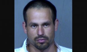 Man arrested in connection to body found after Phoenix fire was put out